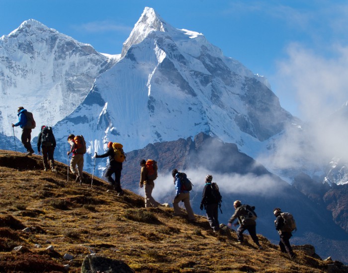 Soldiers to the Summit team trekking above Pherich in the shadow of Ama Dablam. Photo by Didrik Johnck